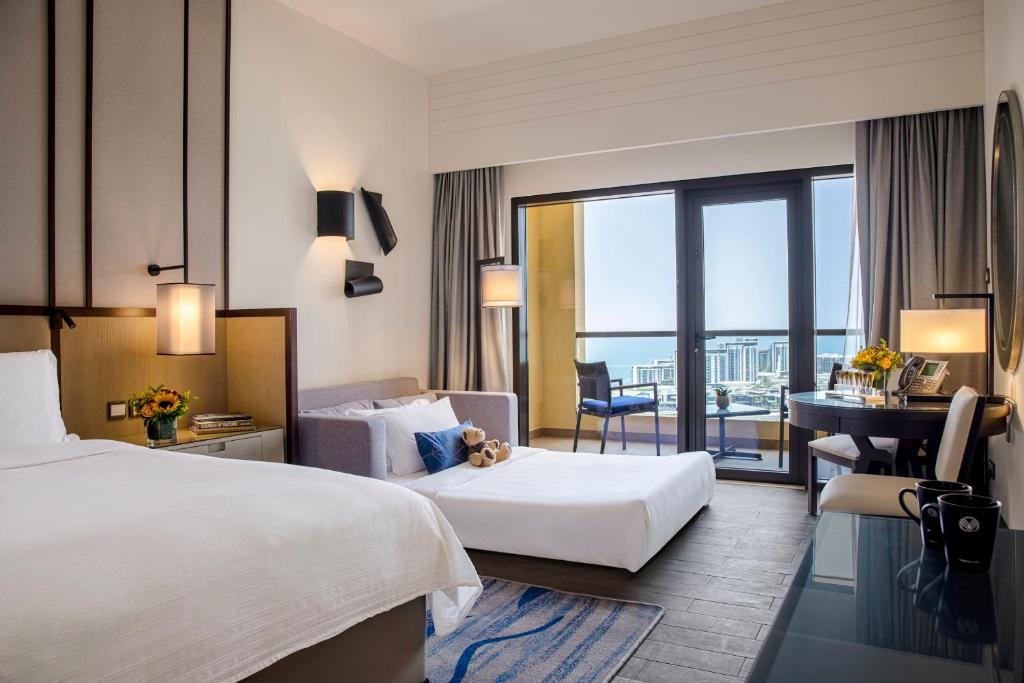 Sea Front View Family Room with Balcony - King Bed - Image 1