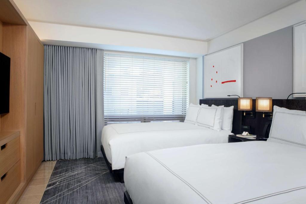 Deluxe Suite with Two Double Beds and Sofa Bed - Image 3