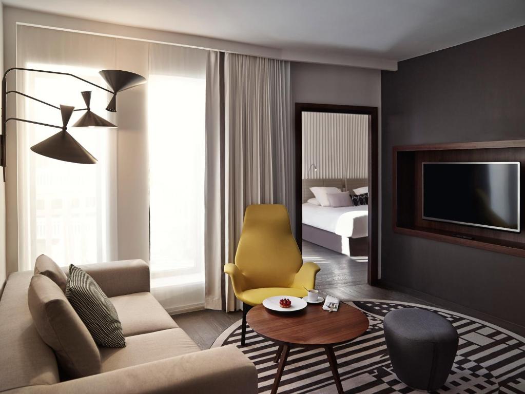 King Suite with Sofa Bed and Lounge Area - Pool View - Image 2