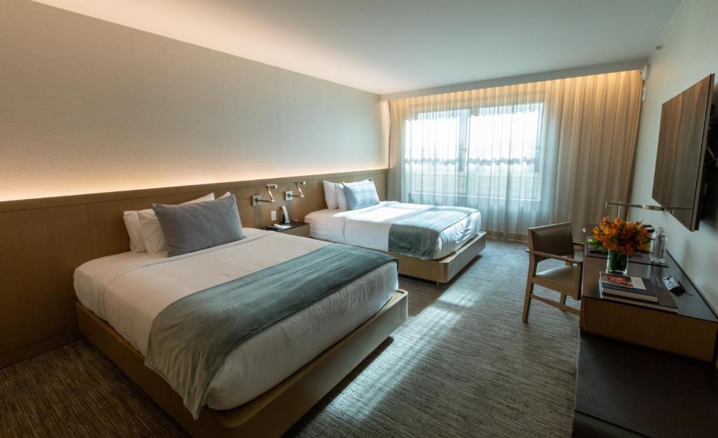 Deluxe Room with Two Queen Beds - Image 2
