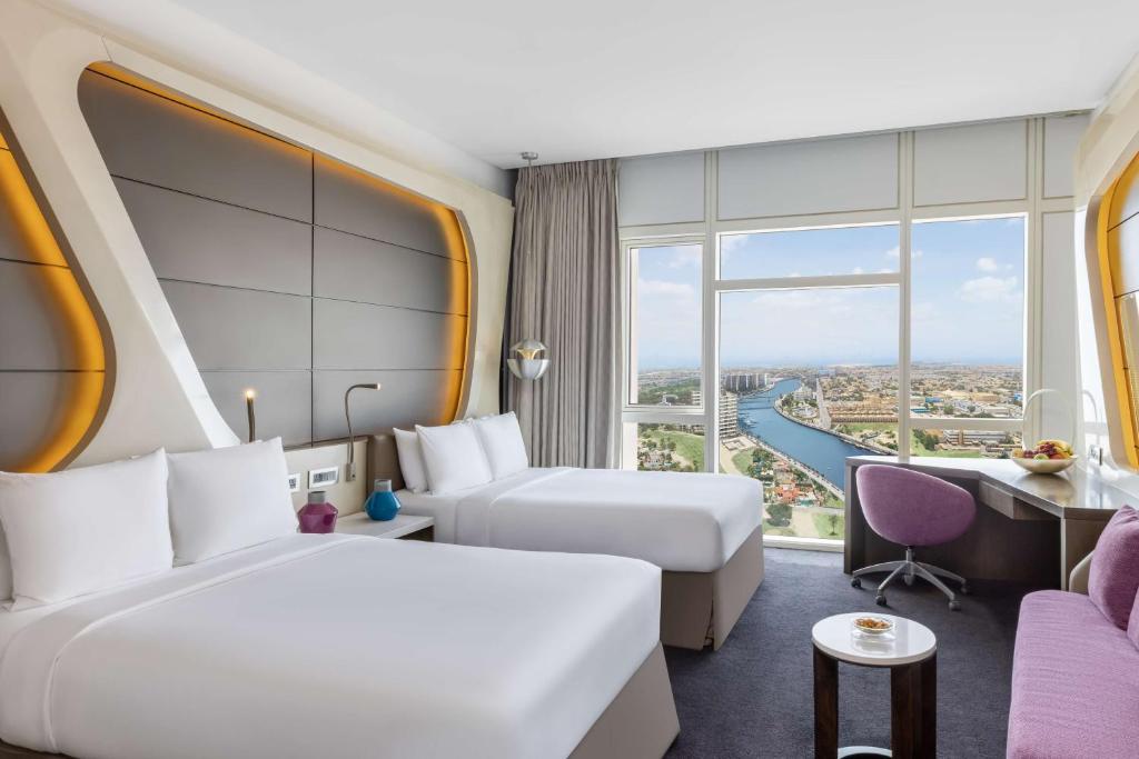 Two Queen Beds Deluxe Room with Canal View - Image 1
