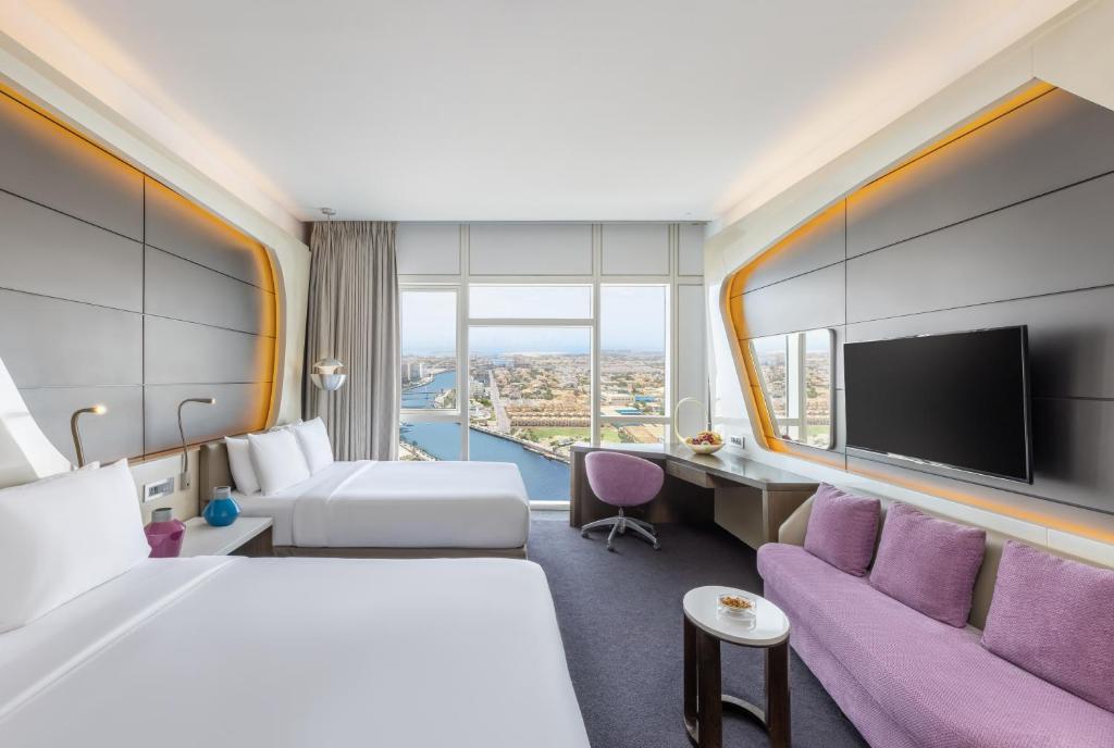 Two Queen Beds Deluxe Room with Canal View - Image 2